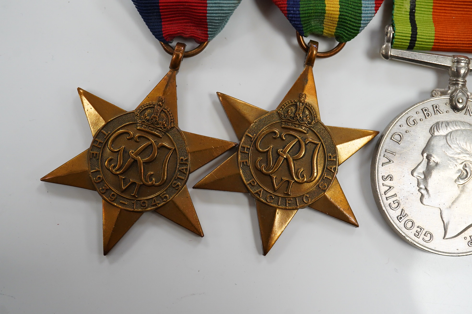 A New Zealand medal group, group of five medals including; The Service to New Zealand Medal 1939-1945, the Pacific star, the 1939 to 1945 star, etc. together with the cased miniature group. Condition - good